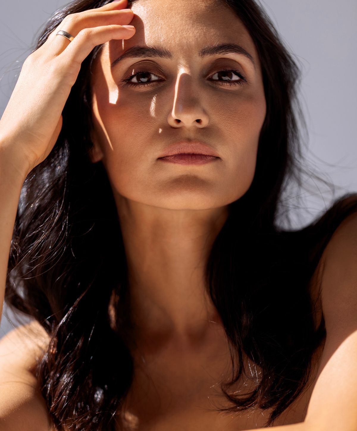 Woman with long hair in natural light.