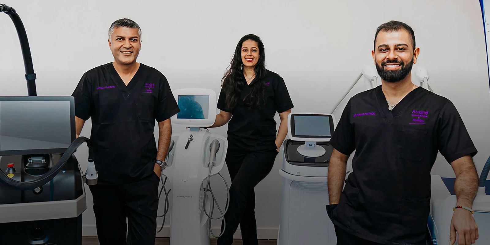 Medical professionals with aesthetic equipment and devices.