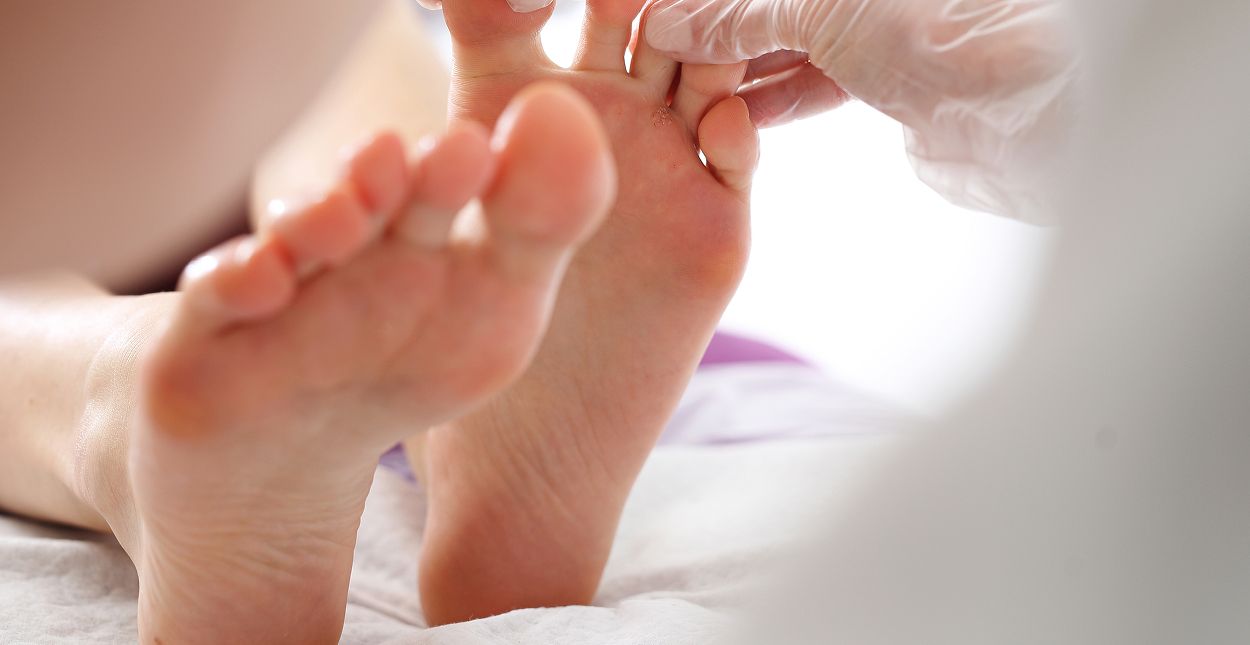 Foot care or treatment session in progress.